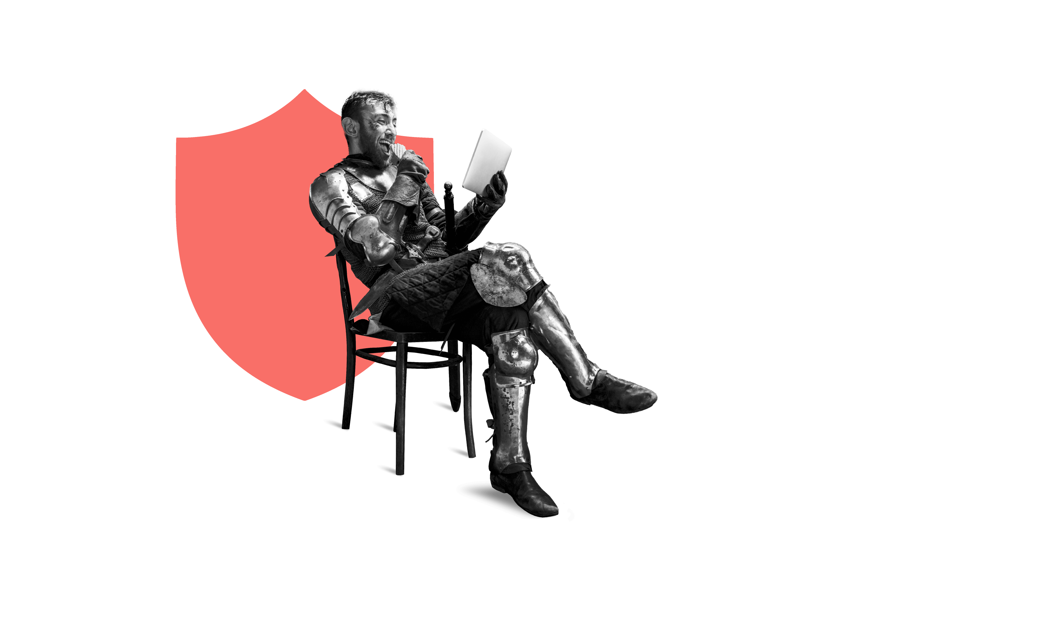 Man in armor sitting on chair with laptop on his lap